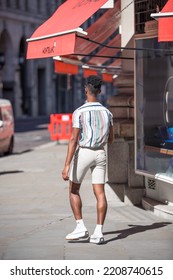 London, UK - June 22, 2022: Young Man Walking In Early Morning In The City. Busy Business Life Of The City. People Rush At Work  Street Photography