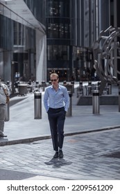 London, UK - June 22, 2022: Businessman Is Walking In Early Morning By The Bank Of England. Busy Business Life Of The City. People Rush At Work  Street Photography