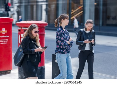 London, UK - June 22, 2022: People Walking On The City Of London Street. Busy Business Life Of The City. People Rush At Work  Street Photography