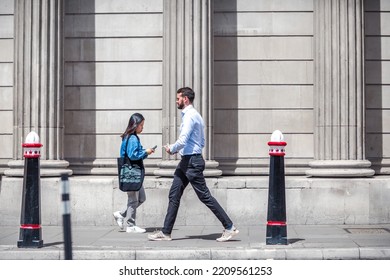 London, UK - June 22, 2022: Business People Walking In Early Morning By The Bank Of England. Busy Business Life Of The City. People Rush At Work  Street Photography