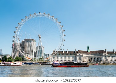 London, UK - June 25, 2018: Sightseeing Tour Boat On Thames River By London Eye, City Hall At Victoria Embankment In Sunny Summer