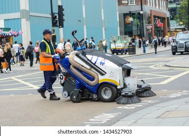 London, UK, June 25, 2019: Street Cleaner Worker With The Vehicle On Oxford Street