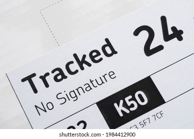 London UK, June 2nd 2021: A Close-up Of A Royal Mail Tracked 24, Next Day Package Delivery Label. No Signature Required. 24 Hour Service, Concept For Postage, Packages, And Courier. Copy Text Space. 