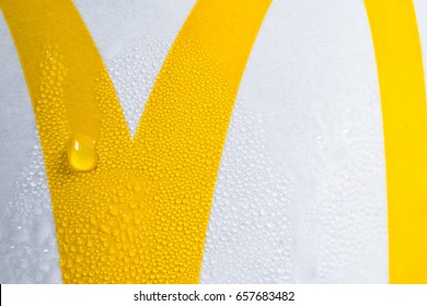 LONDON UK  - JUNE 4th, 2017: McDonald’s Logo On Ice Cold Drink Macro Close Up. Conceptual Image, The Success Of The World’s Largest Chain Of Hamburger Fast Food Restaurants By Appealing To Our Senses.