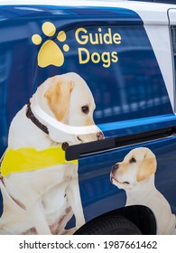 London, UK, June 5th 2021: A Guide Dogs Van With Logo. Image Of Labrador Dog And Puppy Together, For Helping Blind People And Training Dogs. 