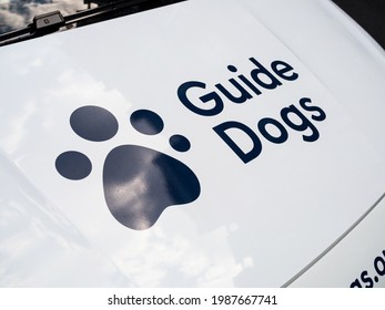 London, UK, June 5th 2021: A Guide Dogs Van With A Dogs Footprint Logo. Helping Blind People And Training Dogs.
