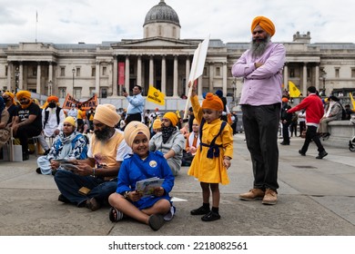 London, UK. June 6 2021. Celebration Of Indian Culture In London’s Trafalgar Square, A Family With A Young Boy Holding A Sign Proudly Aloft.