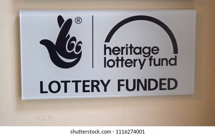 London UK June 7, 2018: Sign Lottery Funded Heritage Lottery Fund On Cream Background.