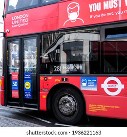 London UK, March 15 2021, Red London Double Decker Bus Advertising Wearing Protective Face Masks During Coronavirus COvid-19 Pandemic