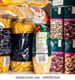 London, UK: March 18, 2020: Cupboard Shelves Fool Of Food Provision, Such As Pasta, Rice, Porridge, Canned Tuna, Beans And More. Panic Buying To Survive Coronavirus COVID 19 Pandemic During Lock Down.