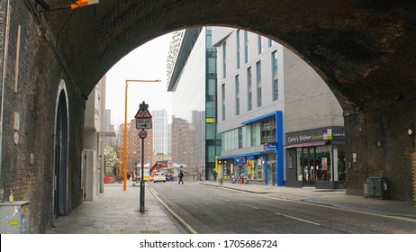 London, UK, March, 20, 2020: Dark Old Arch Under The Bridge At Empty Foggy Street At London Coronavirus Lockdown.