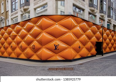 London, UK, March 2019, building site fence panels for a Louis Vuitton shop in the Mayfair area 