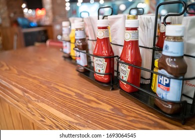 London, UK - March 2020: Ketchup Sauce Bottle In Restaurant. Condiments Served In Fast Food Restaurant. Copyspace
