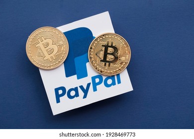 LONDON, UK - March 2021: Bitcoin Cryptocurrency On A Paypal Online Payment Logo