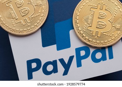 LONDON, UK - March 2021: Bitcoin Cryptocurrency On A Paypal Online Payment Logo