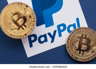 LONDON, UK - March 2021: Bitcoin Cryptocurrency On A Paypal Online Payment Logo