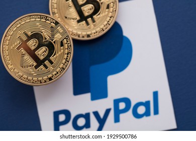 LONDON, UK - March 2021: Bitcoin Cryptocurrency On A Paypal Online Payment Logo