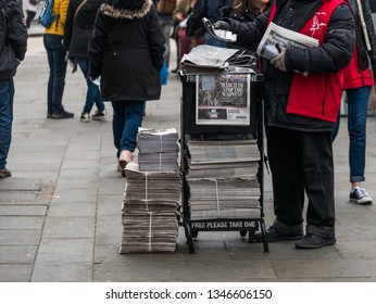 London, UK - March 22 2019: The Newspaper Man Delivery The Evening Standard In The Stree.