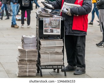 London, UK - March 22 2019: The Newspaper Man Delivery The Evening Standard In The Stree.