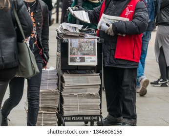 London, UK - March 22 2019: The Newspaper Man Delivery The Evening Standard In The Stree.