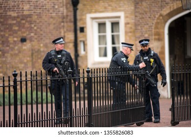 LONDON, UK - MARCH 22, 2019: Armed British Police Officers On Duty Patrolling And Preventing Terrorism Attacks On The Streets Of The City