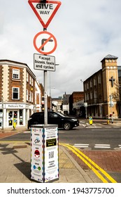 London UK, March 25 2021, Public Health Warnings Fixed To A Road Traffic Sign Post With No People