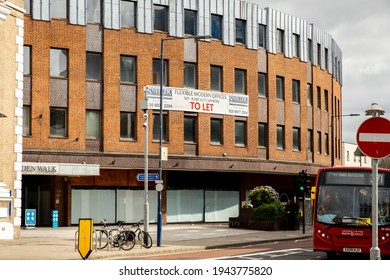 London UK, March 25 2021, Public Transport Single Decker Bus Driving Along Empty High Streets Wirth No People