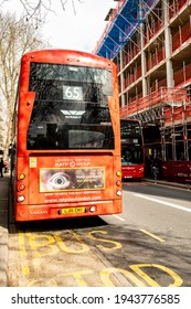 London UK, March 25 2021, Red Public Transport Double Decker Bus Parked At A Bus Stop With No People