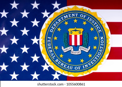 LONDON, UK - MARCH 26TH 2018: The seal of the Federal Bureau of Investigation with the US flag, on 26th March 2018. The FBI is the domestic intelligence and security service of the US.