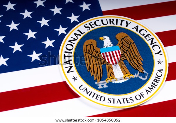 LONDON, UK - MARCH 26TH 2018: The symbol of the National Security Agency portrayed with the US flag, on 26th March 2018. The NSA is a national-level intelligence agency of the US Department of Defense