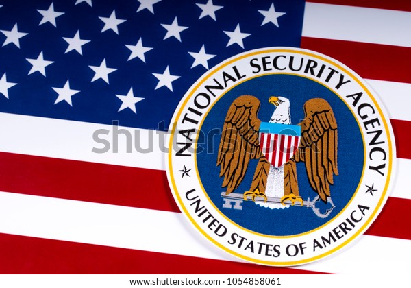 LONDON, UK - MARCH 26TH 2018: The symbol of the National Security Agency portrayed with the US flag, on 26th March 2018. The NSA is a national-level intelligence agency of the US Department of Defense