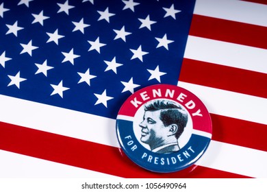 LONDON, UK - MARCH 27TH 2018: A Kennedy For President badge pictured over the USA Flag, on 27th March 2018. John F Kennedy was the 35th President of the United States of America. 