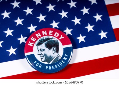 LONDON, UK - MARCH 27TH 2018: A Kennedy For President badge pictured over the USA Flag, on 27th March 2018.  John F Kennedy was the 35th President of the United States of America. 