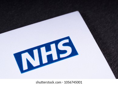 LONDON, UK - MARCH 27TH 2018: A Close-up Of The National Health Service Logo On A Lealfet, On 27th March 2018.  The NHS Is The Name Used For Each Of The Public Health Services In The UK.