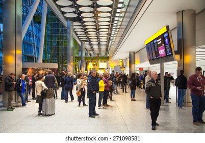 LONDON, UK - MARCH 28, 2015: People Waiting For Arrivals In Heathrow Airport Terminal 5