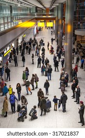 LONDON, UK - MARCH 28, 2015: People Waiting For Arrivals In Heathrow Airport Terminal 5