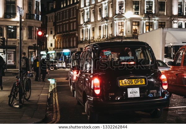 London, UK - March 6, 2019: Close up of\
a black cab on Regent Street in London, UK. London taxis are an\
important part of the capital\'s transport\
system.