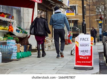 London, UK - March 8, 2020: A Sign Announcing That Face Masks Against The Coronavirus Are Available At A Local Shop In West London