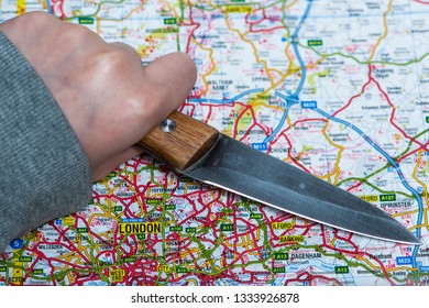 LONDON, UK - MARCH 9 2019: A Knife On A Map Of London, England. Knife Crime In London Concept. 