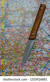 LONDON, UK - MARCH 9 2019: A Knife On A Map Of London, England. Knife Crime In London Concept. 