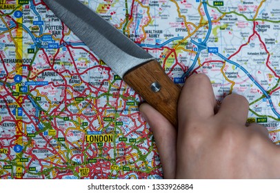 LONDON, UK - MARCH 9 2019: A Knife On A Map Of London, England. Knife Crime In London Concept. 