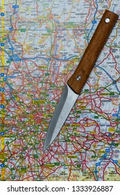 LONDON, UK - MARCH 9 2019: A Knife On A Map Of London, England. Knife Crime In London Concept. 