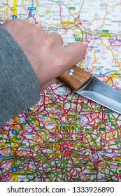 LONDON, UK - MARCH 9 2019: A Knife On A Map Of London, England. Knife Crime In London Concept. 