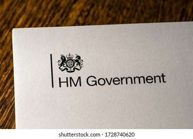 London, UK - May 11th 2020: HM Government Logo On The Front Cover Of The Document Our Plan To Rebuild - The UK Governments COVID-19 Recovery Strategy.