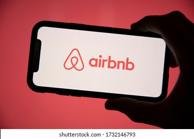 LONDON, UK - May 15 2020: Airbnb home holiday rental logo on a smartphone screen