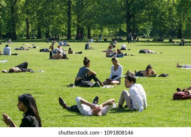 LONDON, UK - MAY 15th 2018: People Enjoy The Hot Sunny Weather In Central London By Relaxing In The Parks