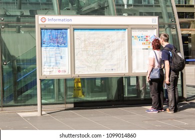 London, UK - May 2018: Couple looking at map to plan their route in London. May 06, 2018.