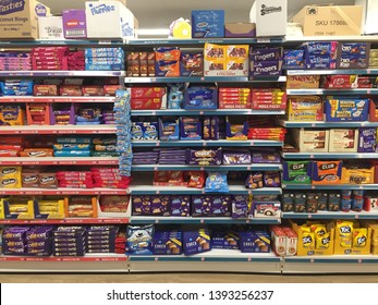 London, UK - May 2019: Supermarket Aisle Of Biscuits, Snacks, Cookies