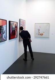 LONDON, UK - MAY 22, 2015: Visitor Views An Artwork In Art15, London's Global Art Fair, Held In Olympia's Grand Hall. 