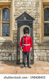 LONDON, UK - MAY 26, 2013: Guard In Castle Tower Of London. British Guards In Red Uniforms Are Among The Most Famous In The World.